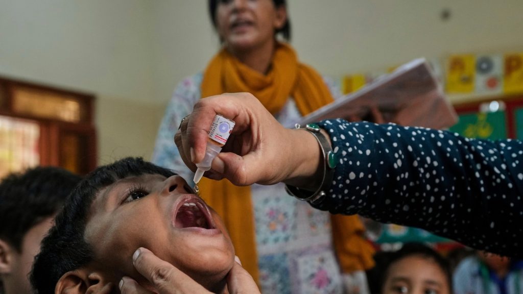 Pakistan police officer killed in attack by gunmen on a polio vaccine team