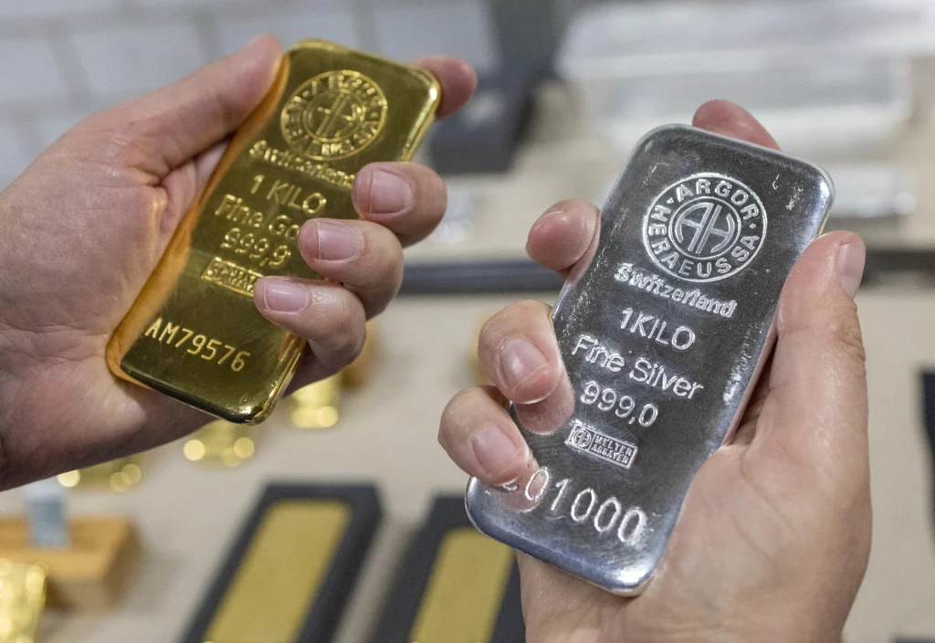 Gold and silver rise from near one-week lows on bargain-hunting