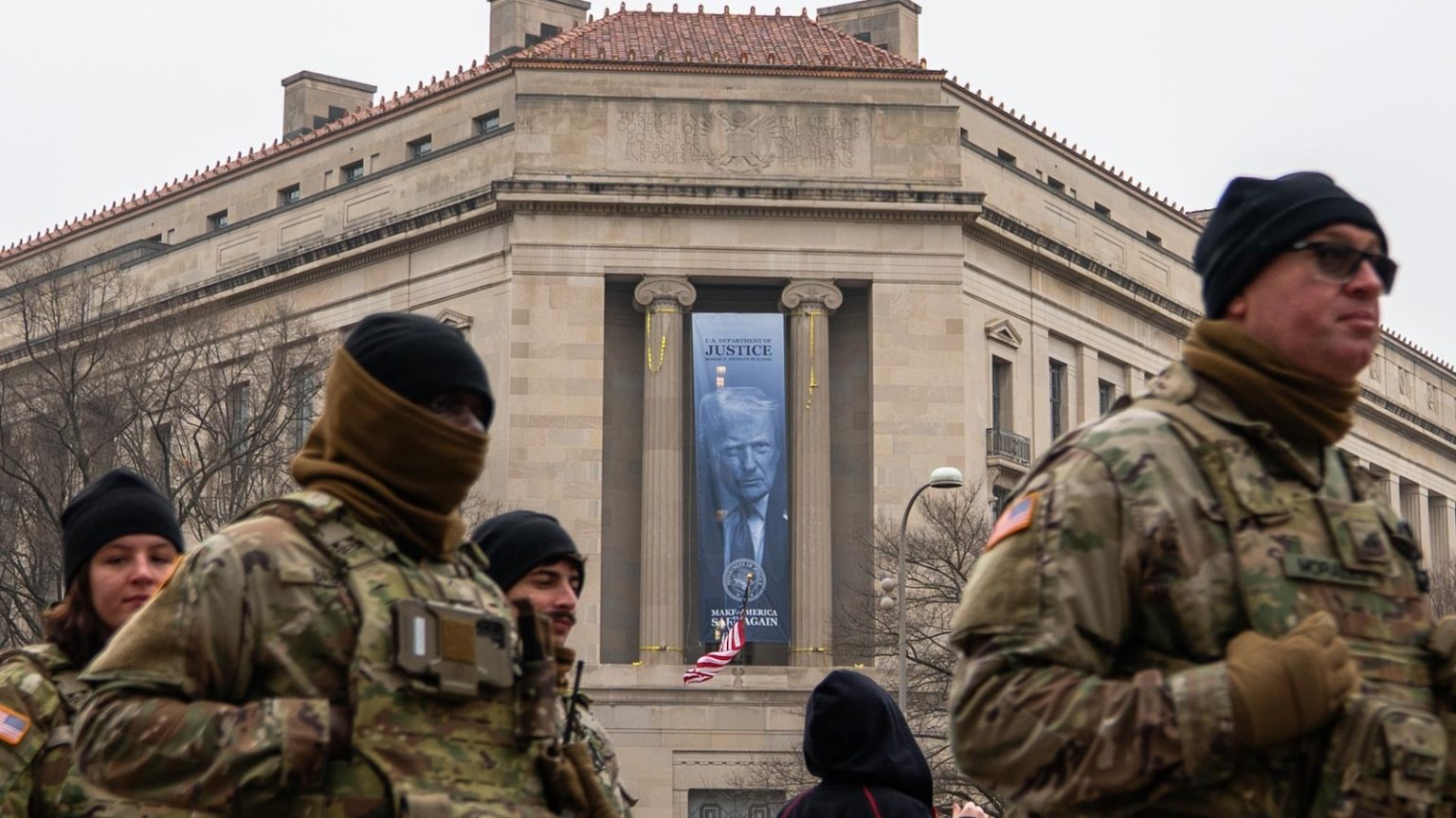 Large banner featuring Trump’s face is displayed on Justice Department headquarters