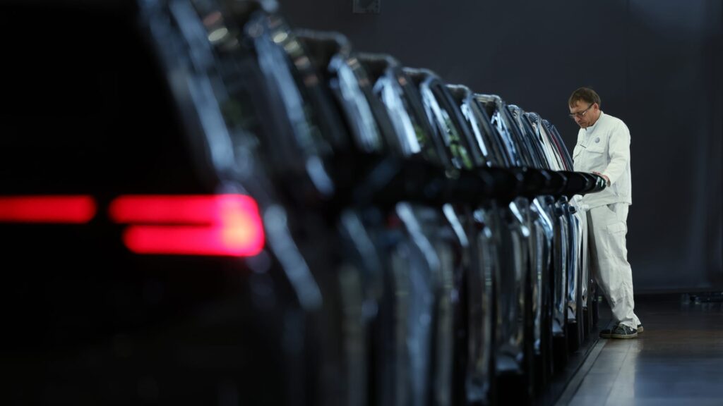 Volkswagen profit falls, revises down full-year revenue outlook