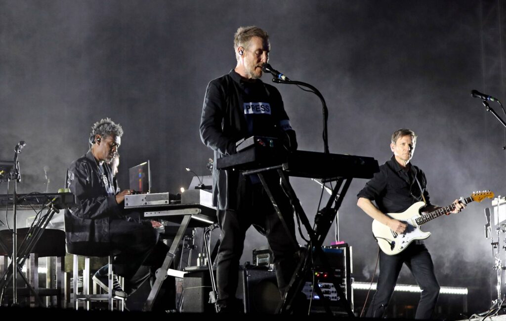 Massive Attack say entire band were detained and some had passports confiscated in Singapore after Palestine flag display
